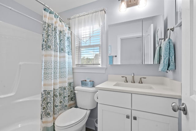 full bathroom with toilet, vanity, and shower / bathtub combination with curtain