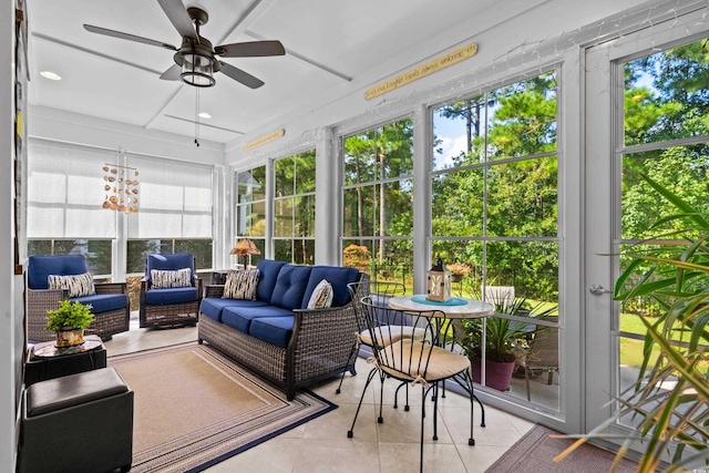 sunroom / solarium featuring ceiling fan