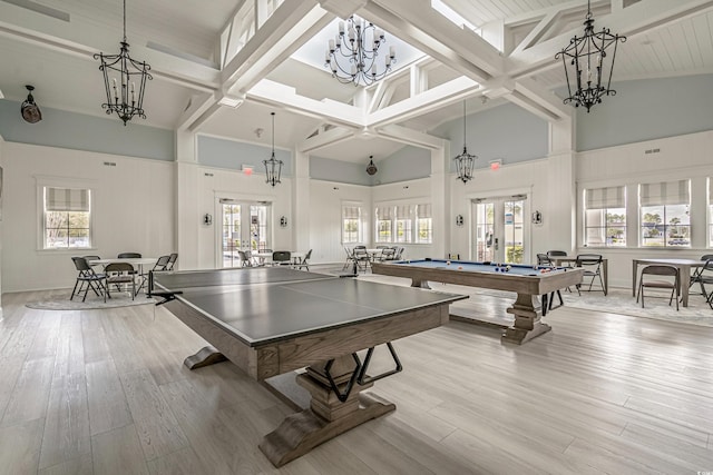 game room with high vaulted ceiling, light wood-type flooring, french doors, and pool table