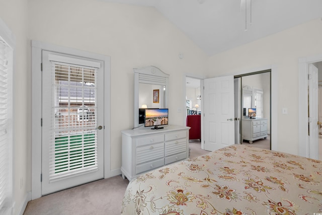 bedroom featuring lofted ceiling, access to outside, and light carpet