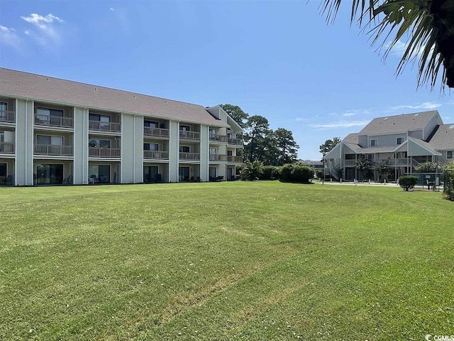 view of community featuring a lawn