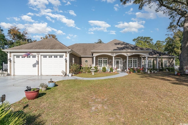 ranch-style home with a garage and a front lawn