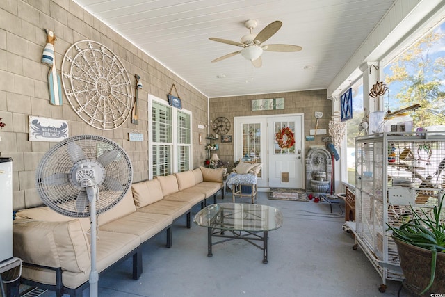 sunroom / solarium with ceiling fan