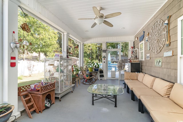 sunroom featuring ceiling fan