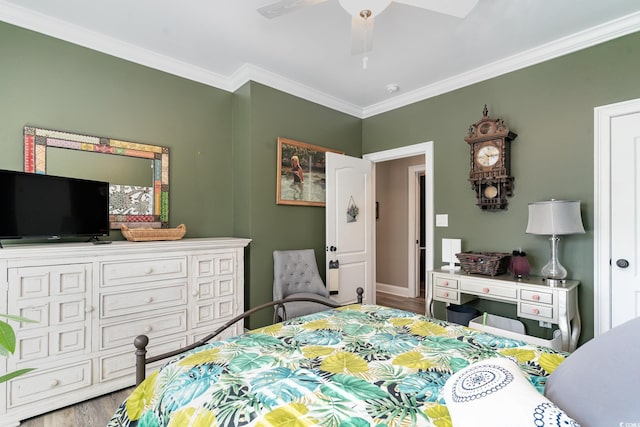 bedroom featuring ornamental molding, hardwood / wood-style floors, and ceiling fan