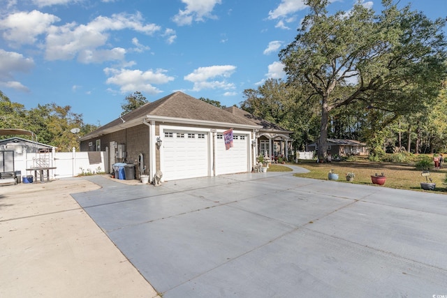 view of property exterior featuring a garage and a yard