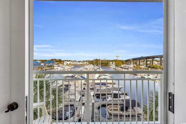 balcony featuring a water view