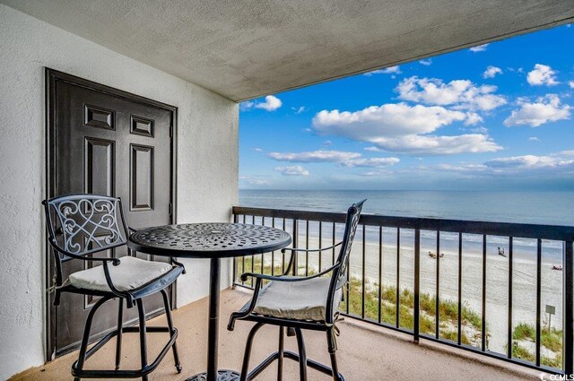 2609 S Ocean Blvd Unit 403, North Myrtle Beach, SC 29582 - balcony featuring view of water and beach