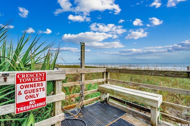2609 S Ocean Blvd Unit 403, North Myrtle Beach, SC 29582 - wooden deck with view of water and beach