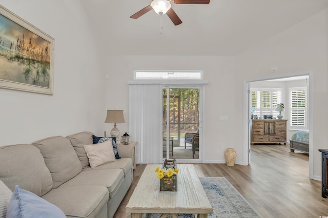 living room with ceiling fan, hardwood / wood-style floors, and a healthy amount of sunlight