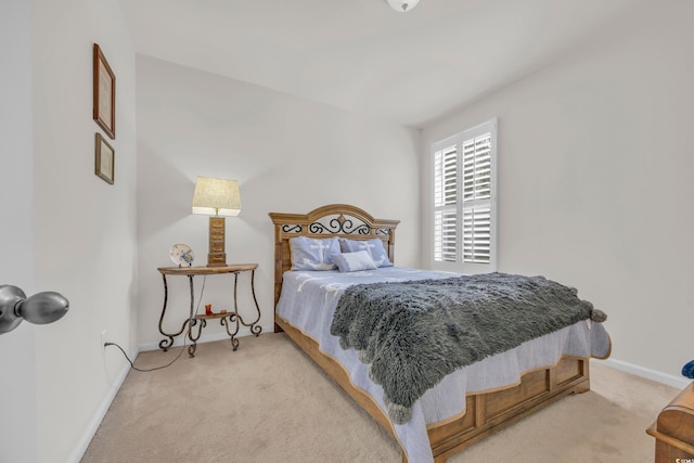 bedroom with light colored carpet