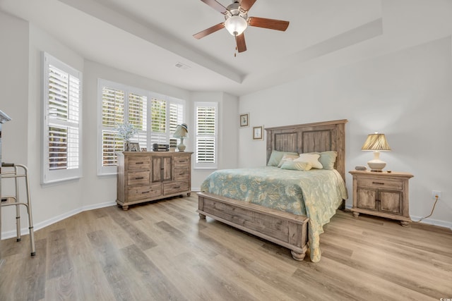 bedroom with ceiling fan and light hardwood / wood-style flooring