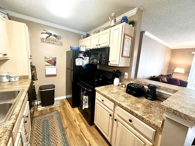 kitchen featuring sink, black appliances, a textured ceiling, crown molding, and light wood-type flooring