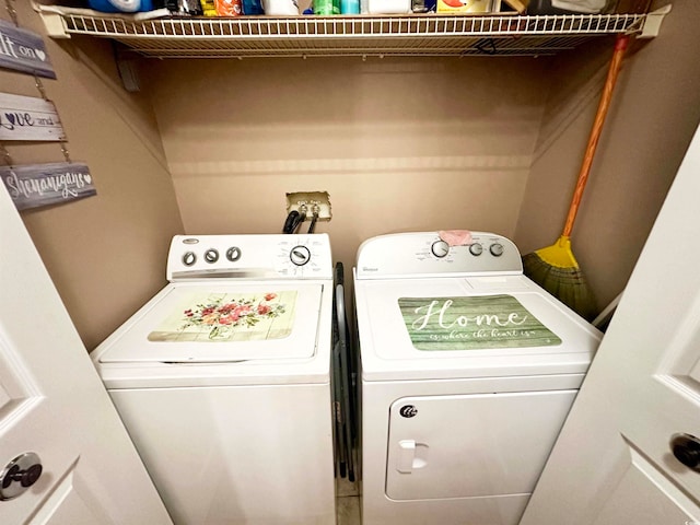 washroom with washer and clothes dryer