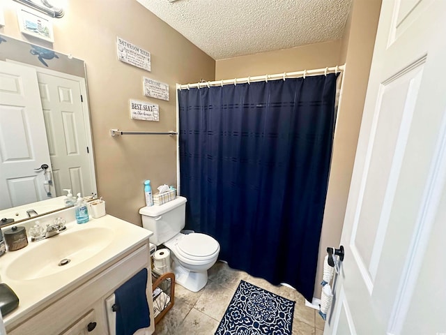 bathroom featuring tile patterned floors, toilet, a textured ceiling, a shower with curtain, and vanity