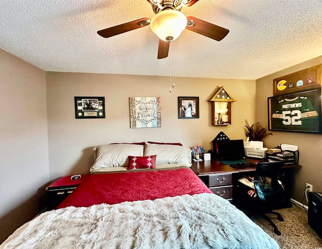 carpeted bedroom with a textured ceiling and ceiling fan