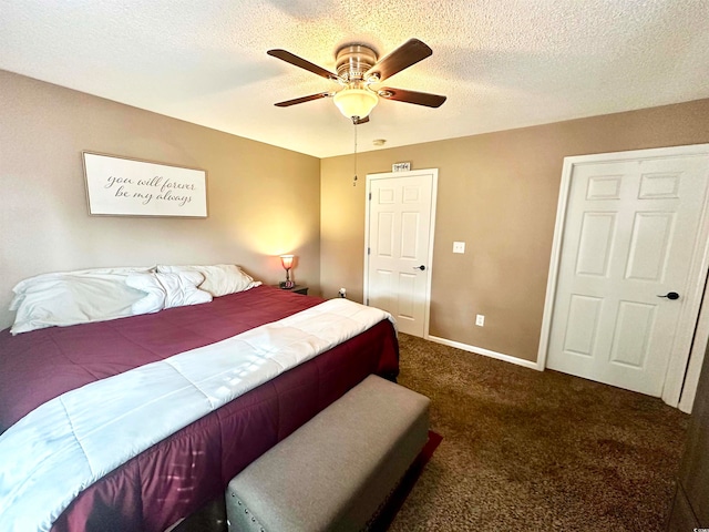 bedroom featuring ceiling fan, a textured ceiling, and dark carpet