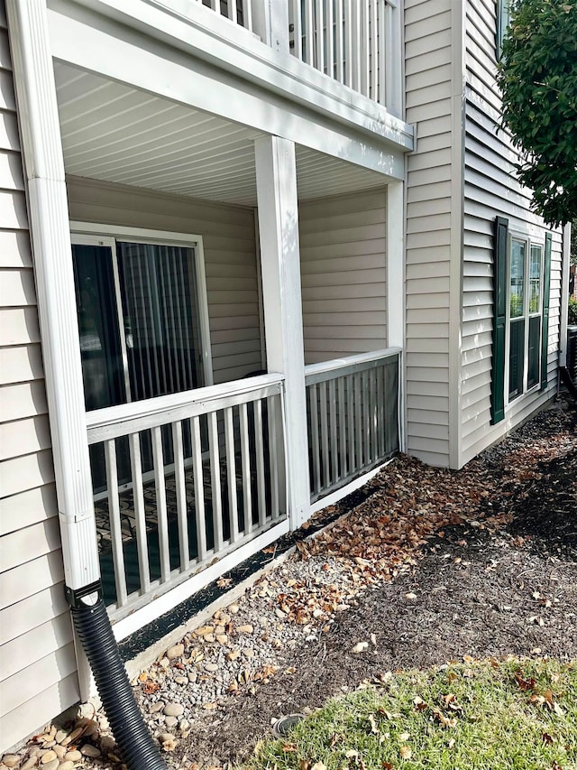 view of home's exterior with a balcony