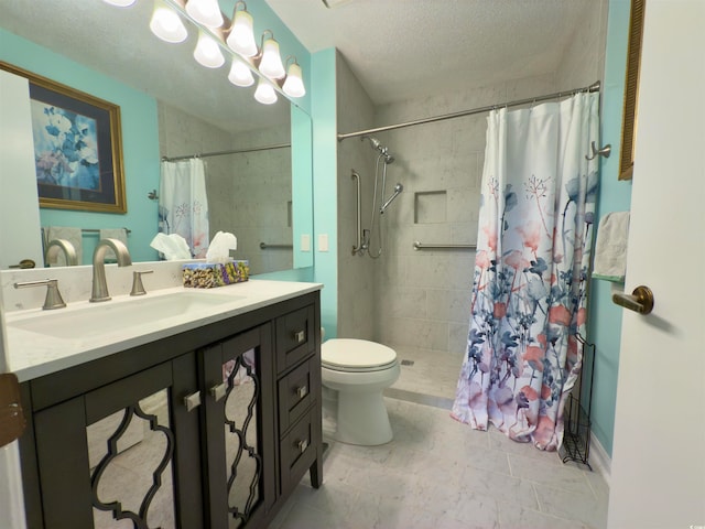 bathroom featuring toilet, a shower with curtain, vanity, and a textured ceiling