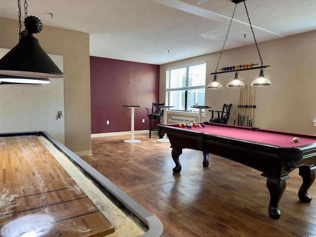 rec room featuring hardwood / wood-style flooring, a textured ceiling, and pool table