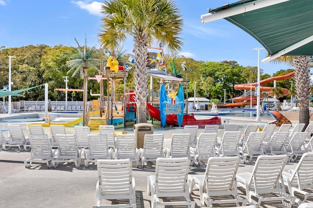 view of playground featuring a community pool