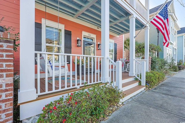 entrance to property featuring covered porch