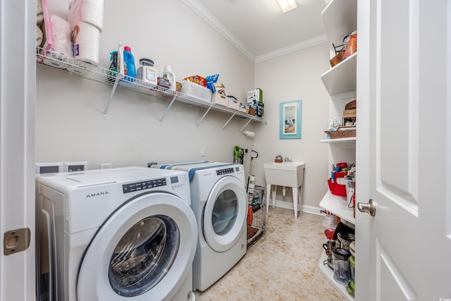 laundry area featuring separate washer and dryer, crown molding, and baseboards