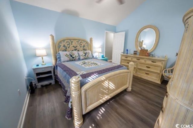 bedroom with ceiling fan, lofted ceiling, and dark hardwood / wood-style floors