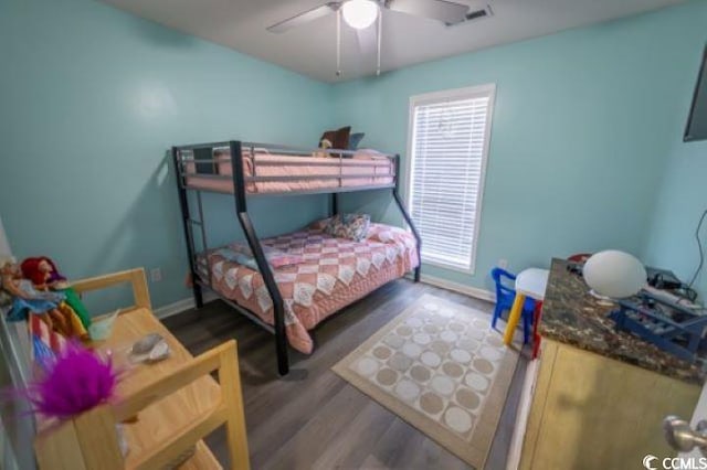 bedroom featuring dark wood-type flooring and ceiling fan