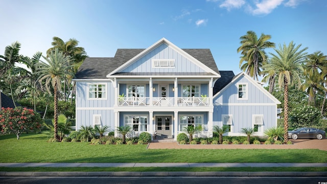 back of property featuring a balcony, a shingled roof, and board and batten siding