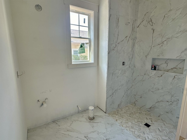 full bathroom with a marble finish shower