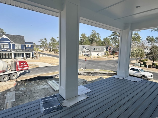 deck featuring a residential view and a porch