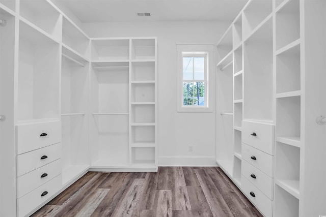 walk in closet featuring visible vents and wood finished floors