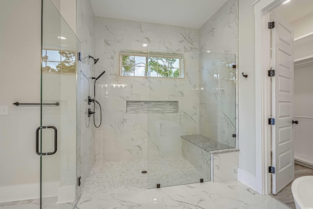 full bathroom featuring a bathtub, marble finish floor, baseboards, and a marble finish shower