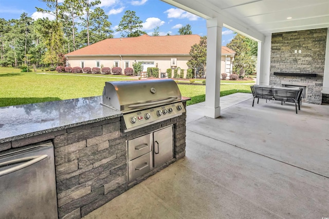 view of patio with exterior kitchen and grilling area