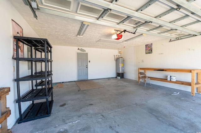 garage featuring electric water heater and a garage door opener