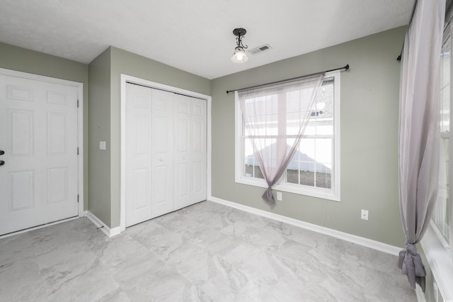 unfurnished bedroom featuring a closet