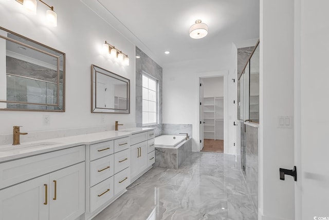 bathroom featuring vanity and separate shower and tub