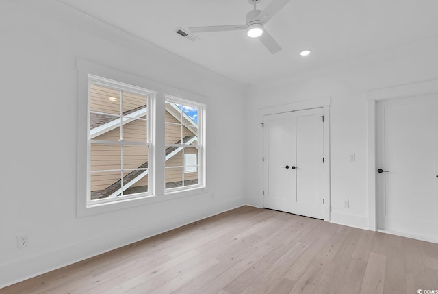 unfurnished bedroom featuring light hardwood / wood-style flooring and ceiling fan