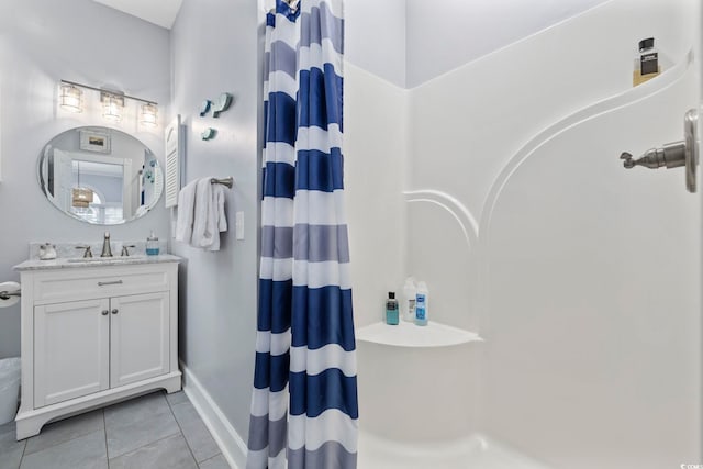 bathroom with vanity, tile patterned floors, and curtained shower