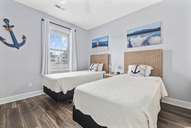 bedroom featuring dark hardwood / wood-style flooring and ceiling fan