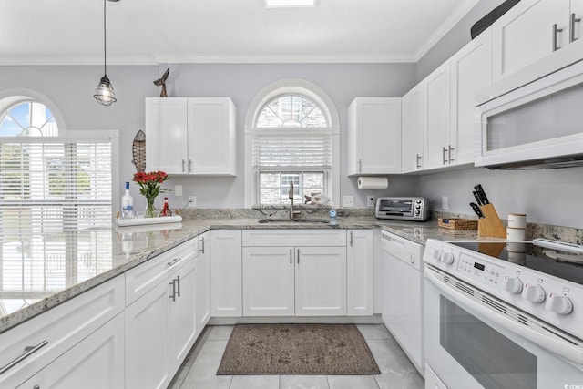 kitchen featuring light stone counters, white cabinets, sink, crown molding, and white appliances