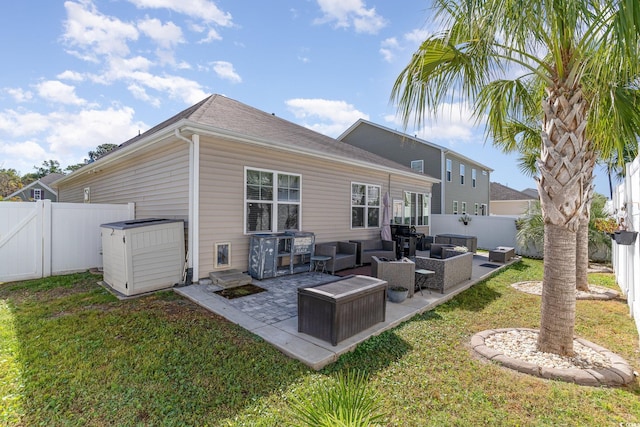 rear view of property with a yard, a fenced backyard, outdoor lounge area, and a patio