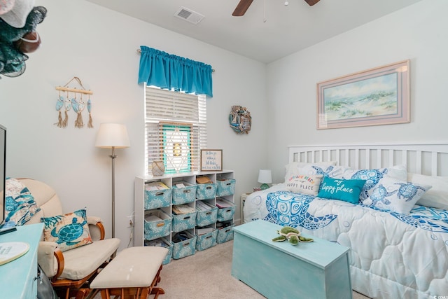 carpeted bedroom featuring visible vents and ceiling fan