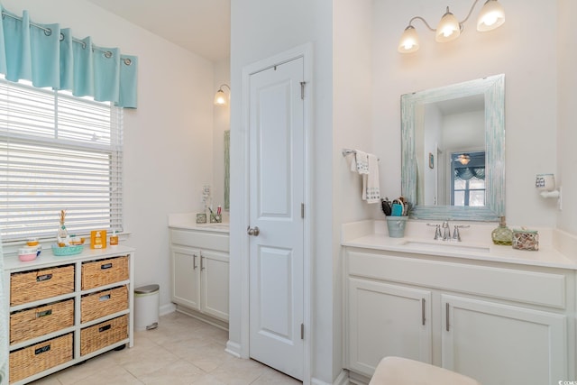 bathroom with tile patterned floors and vanity