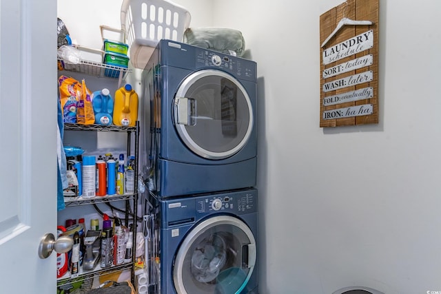 laundry room featuring stacked washer / dryer