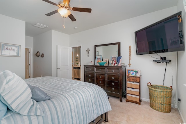 bedroom with visible vents, light colored carpet, a ceiling fan, and baseboards