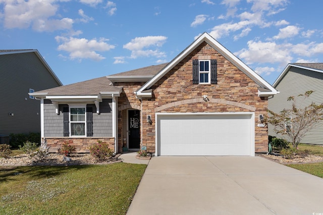 view of front facade with a garage and a front yard