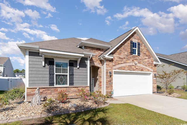 view of front of property with concrete driveway, fence, stone siding, and roof with shingles