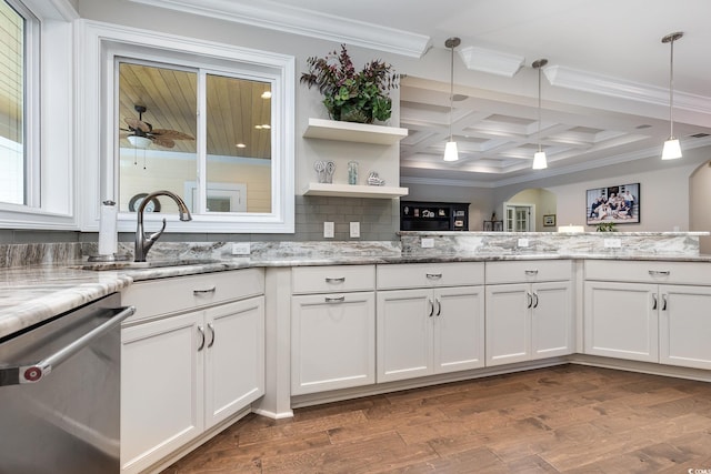 kitchen with white cabinetry, stainless steel dishwasher, coffered ceiling, and light stone counters